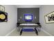 Entertaining game room featuring an air hockey table, stylish decor, and ambient lighting at 9227 Sommerset Hills Dr, Davenport, FL 33896