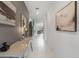 Inviting hallway with elegant tile flooring and stylish decor leading to an open living area at 9227 Sommerset Hills Dr, Davenport, FL 33896