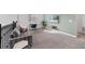 Bright and airy loft area featuring comfortable seating, a desk, and natural light, perfect for relaxing or working at 9227 Sommerset Hills Dr, Davenport, FL 33896