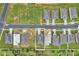 Community aerial view showcases a residential area with homes and landscaping at 928 Pearlwood Loop, Eagle Lake, FL 33839