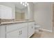 Bathroom features double vanity with granite countertop, modern fixtures, and a tiled shower at 928 Pearlwood Loop, Eagle Lake, FL 33839