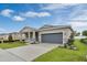 Beautiful single-story home features a two-car garage, manicured lawn, and inviting curb appeal at 928 Pearlwood Loop, Eagle Lake, FL 33839