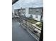 Balcony view overlooking the lawn with white and gray siding, providing a tranquil and stylish outdoor retreat at 1000 S Semoran Blvd # 608, Winter Park, FL 32792