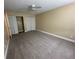 Inviting bedroom with neutral carpet, closet, ceiling fan, and neutral wall color, ideal for relaxation and rest at 1000 S Semoran Blvd # 608, Winter Park, FL 32792