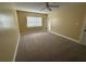 Bright bedroom featuring neutral carpet, window with blinds, and a ceiling fan, offering a comfortable space to unwind at 1000 S Semoran Blvd # 608, Winter Park, FL 32792