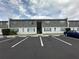 Exterior view of a multi-unit building with reserved parking spots in front at 1000 S Semoran Blvd # 608, Winter Park, FL 32792