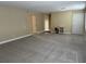 Spacious living room with neutral carpet and paint ready for personal touches at 1000 S Semoran Blvd # 608, Winter Park, FL 32792