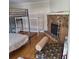 Cozy bedroom with a stone fireplace and multiple bunk beds for ample sleeping space at 10012 Lake Louisa Rd, Clermont, FL 34711