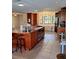Kitchen with a large center island, tile floors and stainless steel appliances at 10012 Lake Louisa Rd, Clermont, FL 34711