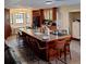 Kitchen view showcasing the island, tile floors, and eat in dining with lots of natural light at 10012 Lake Louisa Rd, Clermont, FL 34711