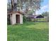 Outbuildings in the backyard need repairs and/or cleanup of the surrounding yard and landscaping at 10012 Lake Louisa Rd, Clermont, FL 34711