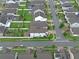 Overhead view of a property highlighting its backyard, landscaping, and proximity to the street at 10078 Hampshire Oaks Dr, Orlando, FL 32825
