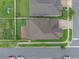 Aerial view of the home showing the roof, driveway, surrounding landscape and neighboring homes at 10078 Hampshire Oaks Dr, Orlando, FL 32825
