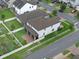 Aerial view of the property's backyard featuring a garden area, screened porch, and well-kept lawn at 10078 Hampshire Oaks Dr, Orlando, FL 32825