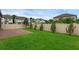 Backyard features lush green lawn, brick patio, and a privacy fence providing a serene outdoor space at 10078 Hampshire Oaks Dr, Orlando, FL 32825