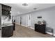 Basement kitchenette with dark cabinets, sink, and bar area at 10078 Hampshire Oaks Dr, Orlando, FL 32825