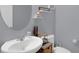 Cozy bathroom featuring a large vanity, decorative mirror, and toilet with ample space at 10078 Hampshire Oaks Dr, Orlando, FL 32825