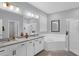 Bathroom featuring double vanity, granite countertops, separate tub and shower, and good lighting at 10078 Hampshire Oaks Dr, Orlando, FL 32825