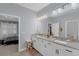 Bathroom featuring double vanity, granite countertops, tile floor, and good lighting at 10078 Hampshire Oaks Dr, Orlando, FL 32825
