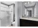 Elegant bathroom with granite countertops, dark wood cabinets, and glass shower at 10078 Hampshire Oaks Dr, Orlando, FL 32825