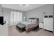 Comfortable bedroom with tile floors, neutral paint, a ceiling fan, and plenty of natural light at 10078 Hampshire Oaks Dr, Orlando, FL 32825