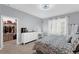 Comfortable bedroom featuring tile floors, neutral paint, closet, and a vanity area at 10078 Hampshire Oaks Dr, Orlando, FL 32825