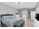 Comfortable bedroom featuring tile floors, neutral paint, ceiling fan, and a door to the Primary bath at 10078 Hampshire Oaks Dr, Orlando, FL 32825