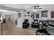 Entertainment room with theater seats, new flooring, and custom art at 10078 Hampshire Oaks Dr, Orlando, FL 32825