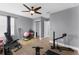 Versatile home gym with exercise equipment, ceiling fan, and durable floors at 10078 Hampshire Oaks Dr, Orlando, FL 32825