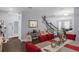 Open living area with dark wood floors and decorative furniture at 10078 Hampshire Oaks Dr, Orlando, FL 32825