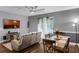 Bright living room with a large window, a ceiling fan, and open floor plan at 10078 Hampshire Oaks Dr, Orlando, FL 32825