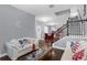 Comfortable living room with a sofa, staircase, and open layout at 10078 Hampshire Oaks Dr, Orlando, FL 32825