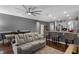 Spacious living area with a ceiling fan, dining table, and kitchen bar at 10078 Hampshire Oaks Dr, Orlando, FL 32825