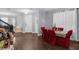 Spacious living room with wood flooring, dining table, and stairs at 10078 Hampshire Oaks Dr, Orlando, FL 32825