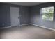 Inviting living room with neutral tile flooring and a bright window for ample natural light at 102 Luna Rd, Auburndale, FL 33823