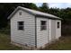 Outdoor shed providing additional storage space with durable siding and secure access at 102 Luna Rd, Auburndale, FL 33823