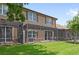 Large grassy backyard featuring a screened lanai and comfortable outdoor seating at 10308 Belfry Cir, Orlando, FL 32832