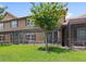 Backyard with a screened lanai and view of the two-story home at 10308 Belfry Cir, Orlando, FL 32832