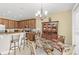 The dining area features a chandelier, and a wooden china cabinet with glass doors for displaying decor at 10308 Belfry Cir, Orlando, FL 32832
