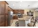 Spacious kitchen featuring a breakfast bar, stainless appliances, and well organized counter space at 10308 Belfry Cir, Orlando, FL 32832