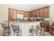 Well-equipped kitchen with breakfast bar, stainless steel appliances, and ample cabinet space at 10308 Belfry Cir, Orlando, FL 32832