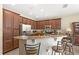 Charming kitchen featuring stainless steel appliances, ample counter space, and a breakfast bar at 10308 Belfry Cir, Orlando, FL 32832