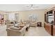 Inviting living room showcasing tile flooring, neutral walls, and comfortable seating at 10308 Belfry Cir, Orlando, FL 32832