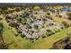 Aerial view of the community showcasing landscaping and proximity to a pond at 1126 Villa Ln # 91, Apopka, FL 32712