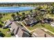 Scenic aerial view of homes with lush trees and well-kept landscaping near a pond at 1126 Villa Ln # 91, Apopka, FL 32712