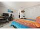 Comfortable bedroom featuring a desk, ample storage, and stylish decor with a cozy aesthetic at 1126 Villa Ln # 91, Apopka, FL 32712