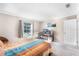 Bedroom with a bed, desk, and a window overlooking the outdoors at 1126 Villa Ln # 91, Apopka, FL 32712