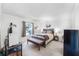 Bedroom features a bed with bench seat and a window overlooking the outdoors at 1126 Villa Ln # 91, Apopka, FL 32712