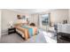 Bedroom features a bed, desk and lots of natural light at 1126 Villa Ln # 91, Apopka, FL 32712