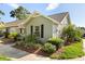 Charming home featuring well-maintained landscaping with mature palm trees and mulch at 1126 Villa Ln # 91, Apopka, FL 32712